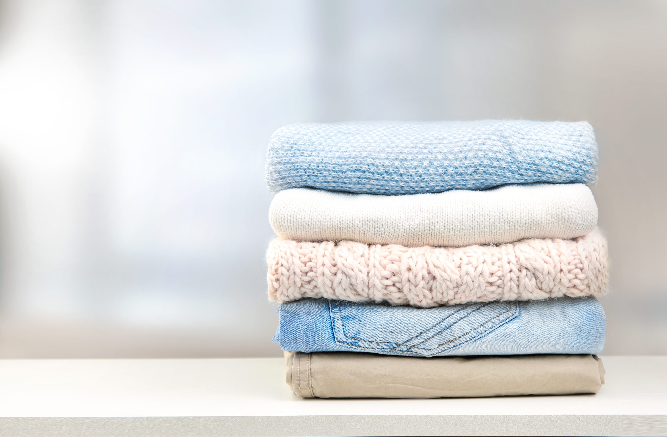 Stack of clothes empty copy space.